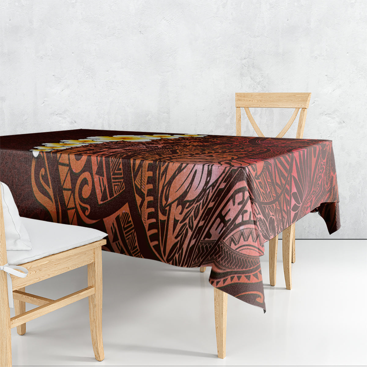 Red tablecloth draped over dining table with Polynesian tribal print