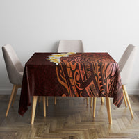Red tablecloth with Polynesian tribal print on square dining table