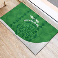 Green rubber doormat with Northern Ireland crest, custom text, and white border