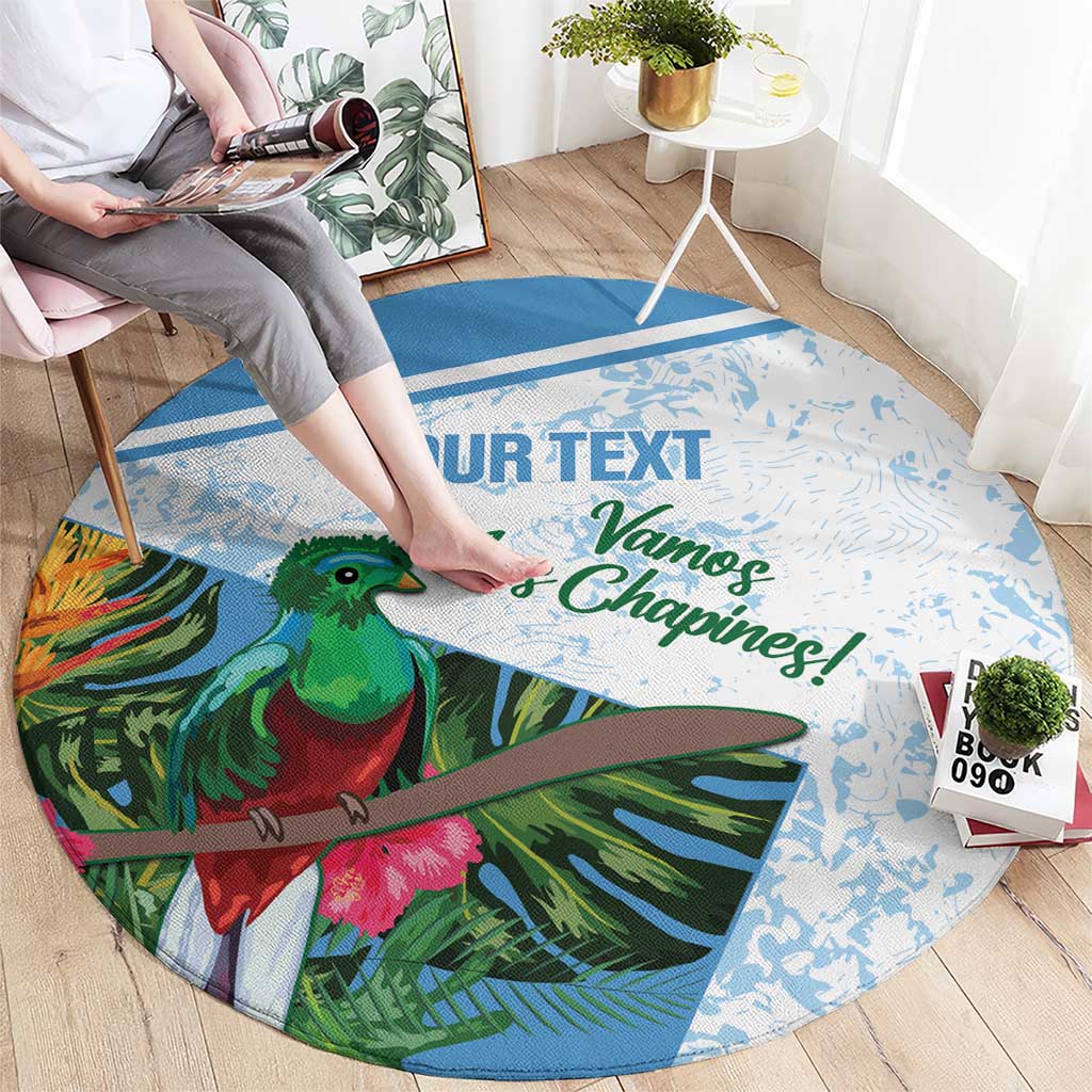 Round blue carpet with green bird and tropical leaf graphic, text across center