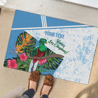 Custom football rubber doormat with green bird and pink flowers, blue-and-white