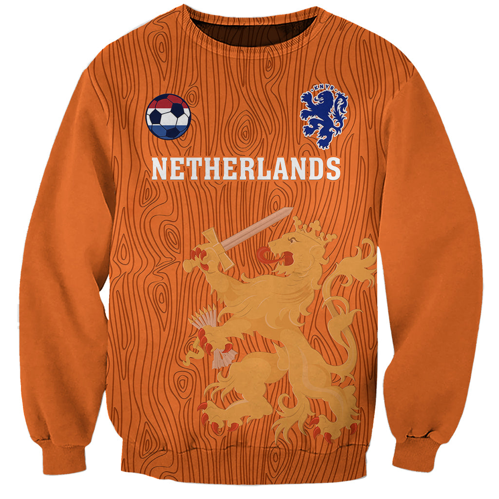 Orange crewneck sweatshirt with Netherlands front graphic, soccer ball and crest