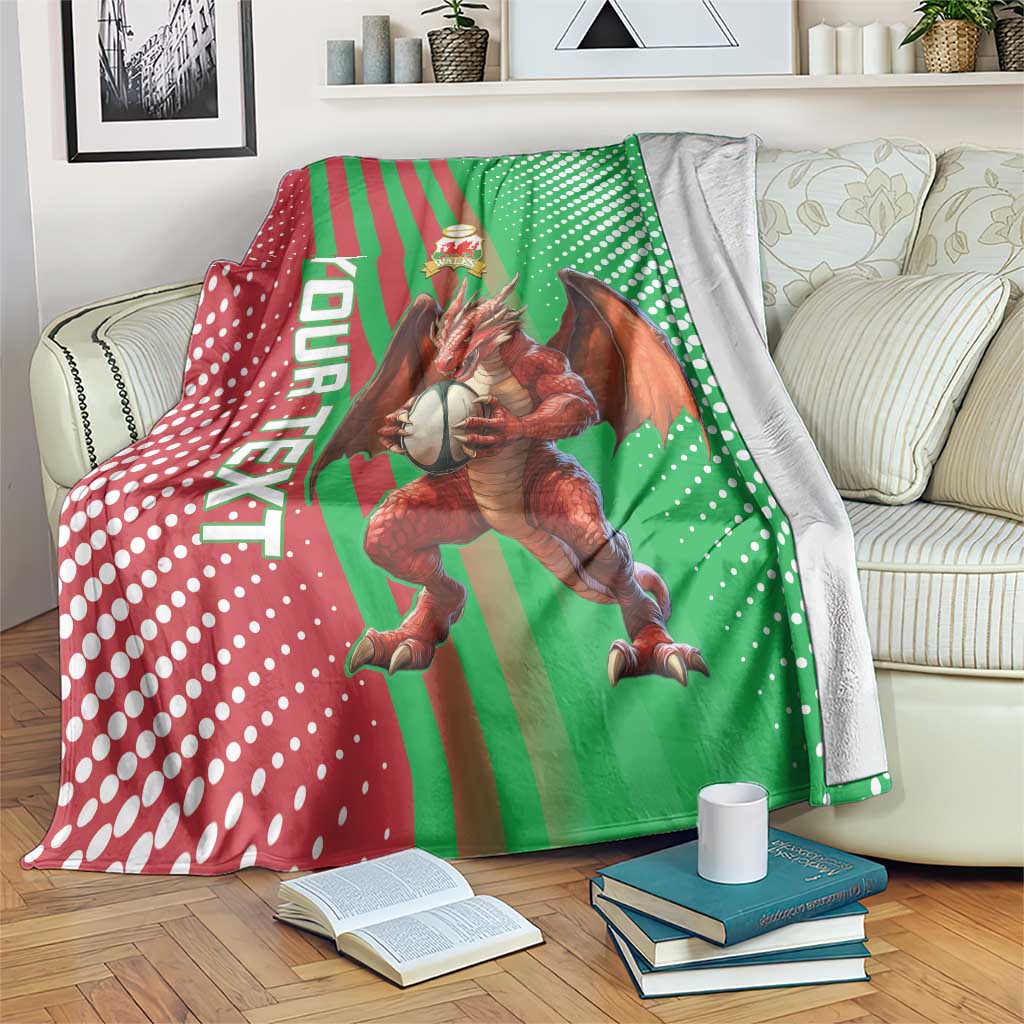 Green Wales rugby blanket with red diagonal stripes, white dots, dragon mascot graphic