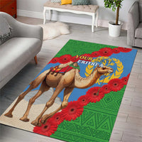 Green area rug with camel and Eritrea flag graphic, red flowers border, blue emblem center