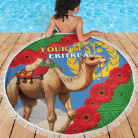 Round beach blanket with Eritrea text, camel and red flowers, white fringed edge