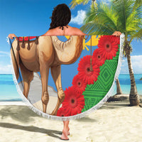 Round beach blanket featuring camel and red flowers with Eritrea text, white fringe