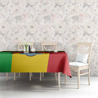 Personalised Mali tablecloth on dining set, yellow/green/red coat-of-arms vulture pattern