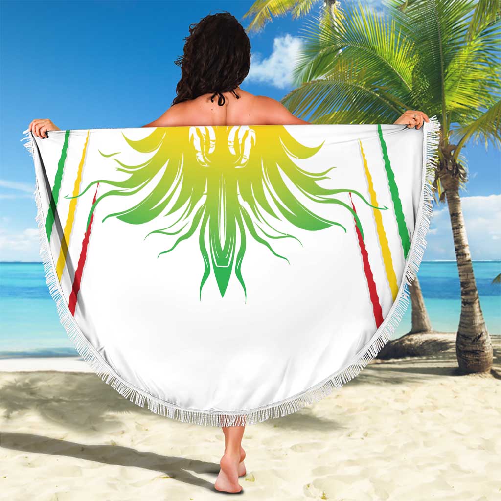 Round beach blanket, white with Mali lion crest graphic and multicolor accents, fringe