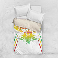 White duvet cover set with eagle-wing print, green detailing, and red and yellow stripes