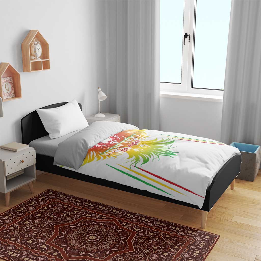 White bedding set on bed with colorful eagle wing graphic on duvet and matching pillow