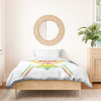 White duvet cover with multicolor eagle wings design and matching pillow in bright stripes