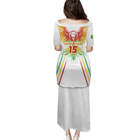 White long soccer dress with eagle graphic and number 15 on back, short sleeves