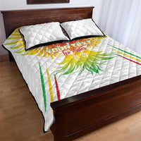 White quilt bed set with eagle graphic, two pillows, and black-trim edges
