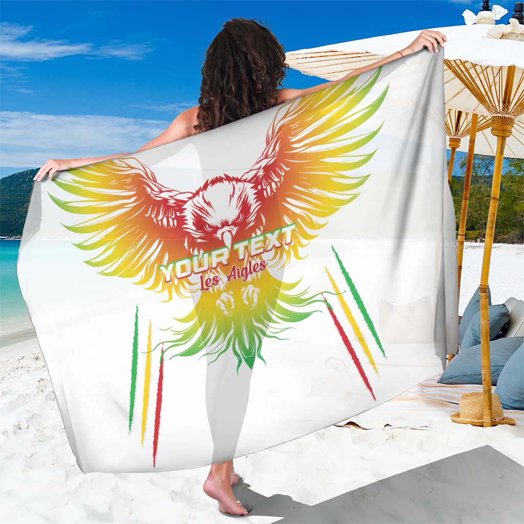 White football sarong with colorful eagle feather graphic and center text, worn and draped