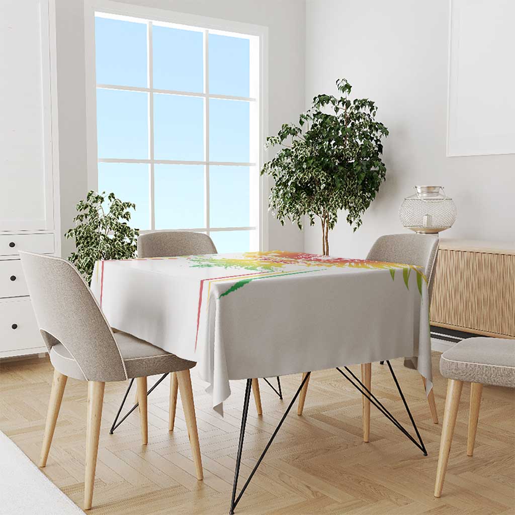 White football tablecloth draped over rectangular dining table with colorful crest at center