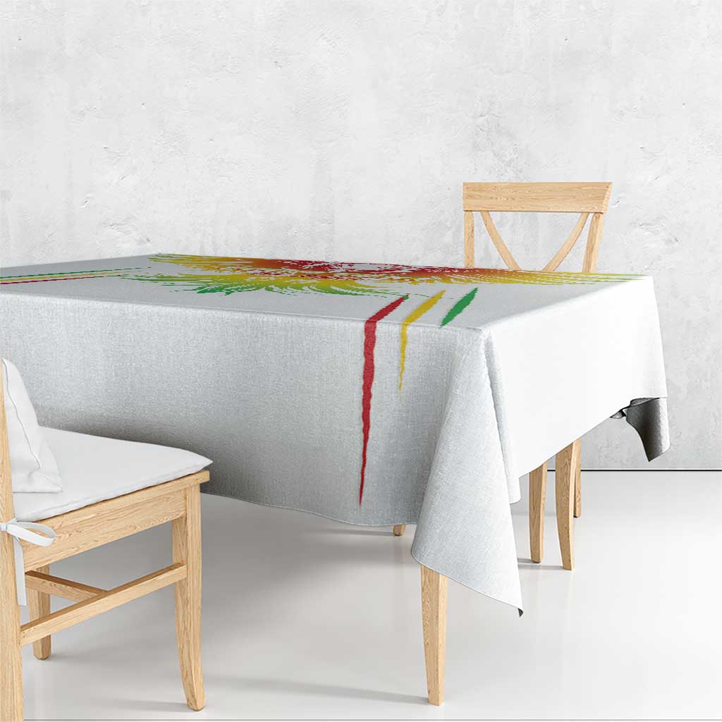 White football tablecloth with colorful edge stripes and crest, covering dining table