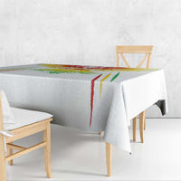 White football tablecloth with colorful edge stripes and crest, covering dining table