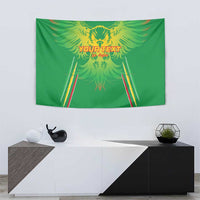 Green football tapestry with yellow eagle graphic and red-yellow striped goal posts