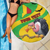 Round beach blanket by pool, yellow/green Mali map and vulture graphic with white fringe