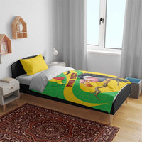 Bedroom bed with yellow bedding set showing Mali map and vulture graphic, with matching pillows