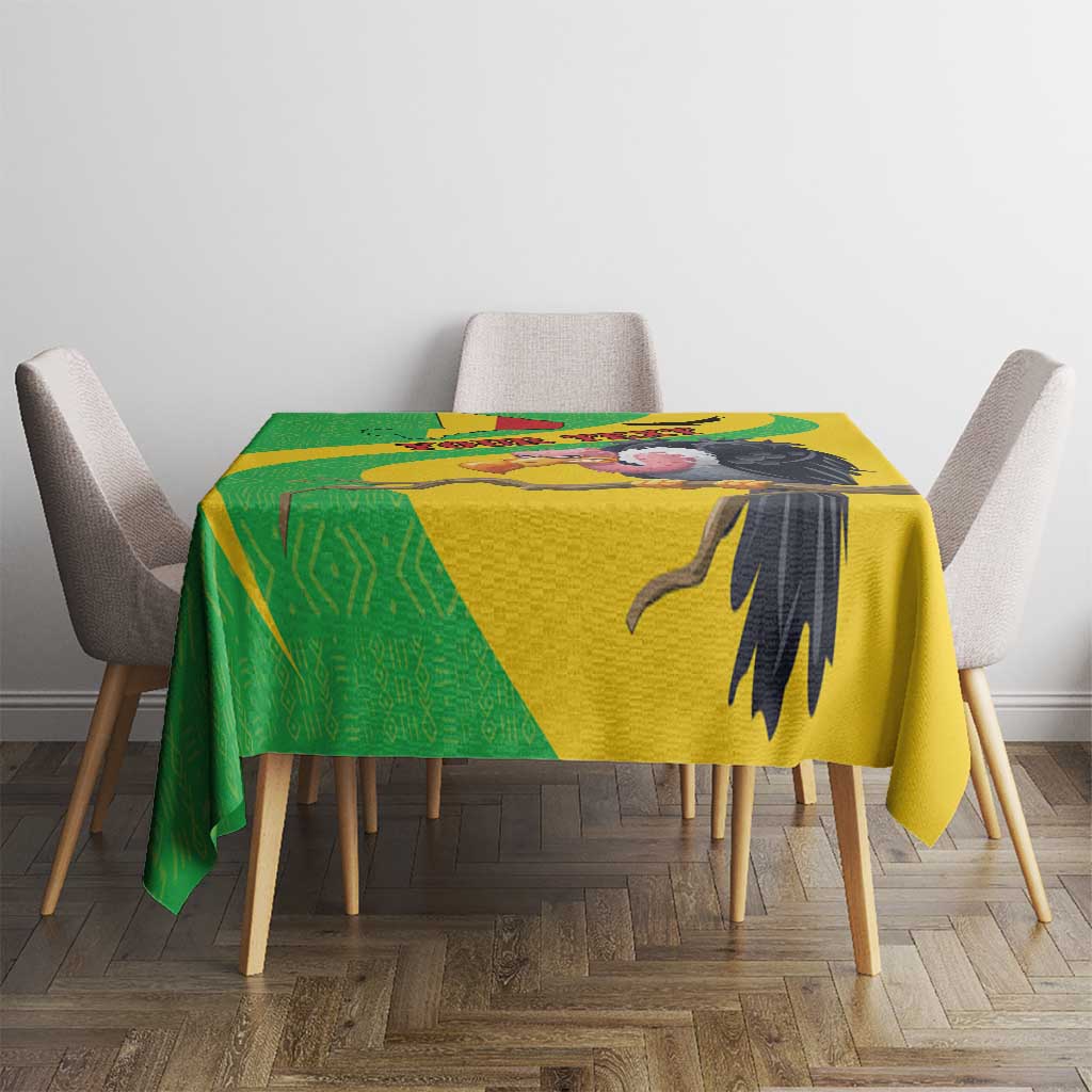 Yellow Mali vulture tablecloth with green panel and black beak-and-wing artwork.