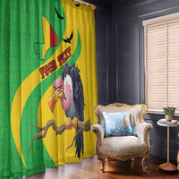 Hanging window curtains with Mali map and vulture print, green and yellow beside chair
