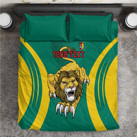 Green and yellow football bedding set overhead view with lion graphic, two pillows, “Your Text”.