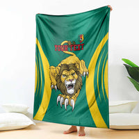 Green football blanket draped, yellow side stripes, roaring lion center, Your Text