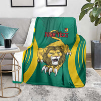 Green football blanket on floor with yellow stripes and roaring lion graphic, Your Text