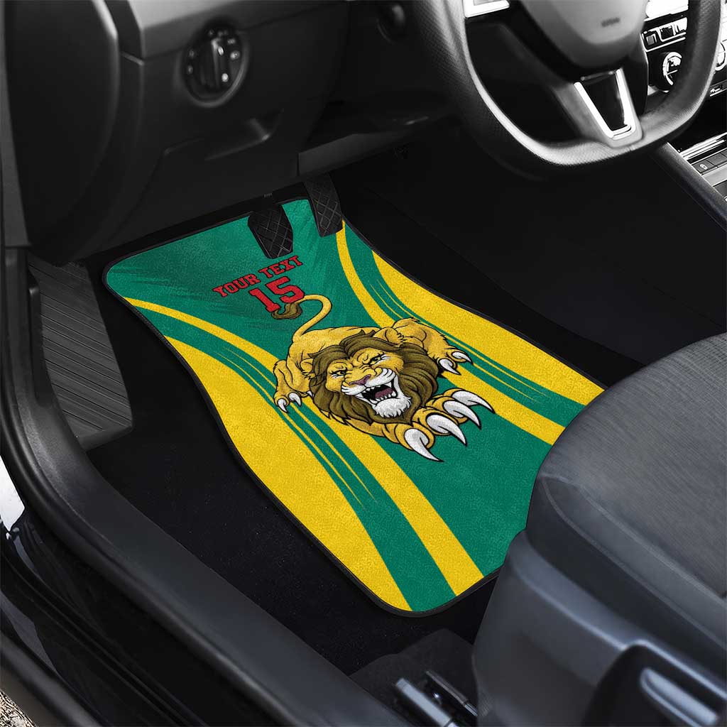 Green car floor mat with lion artwork, yellow/green stripe rays, and “YOUR TEXT 15”