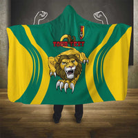 Green hooded blanket with lion head, red "YOUR TEXT", yellow arc stripes, crest badge