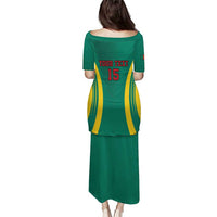 Green long dress, back view, short sleeves with number 15 and yellow-red stripes