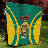Green quilt with yellow wave stripes, roaring lion and 'YOUR TEXT' printed in the middle