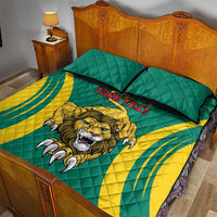 Green quilt with lion graphic and black piping, shown with two pillowcases