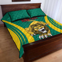 Green and yellow quilt bed set with lion graphic and red “YOUR TEXT” on bed, two pillows