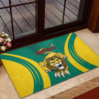 Green rubber doormat with lion head emblem and 'YOUR TEXT' between curved yellow stripes