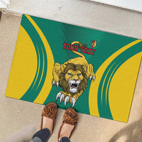 Green rubber doormat with lion face and curved yellow stripes, 'YOUR TEXT' shown