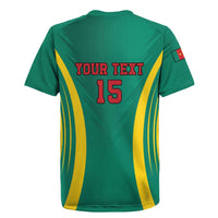 Green rugby jersey back with yellow chevron stripes, red 'YOUR TEXT' and number 15