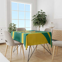 Green and yellow football tablecloth with bold geometric stripes draped over a dining table