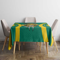 Green and yellow football tablecloth featuring a central emblem and rounded stripe borders