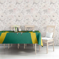 Green and yellow football tablecloth with centered emblem and striped runner design