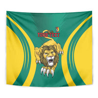 Cameroon football tapestry close-up with lion face, yellow wave stripes, and red "YOUR TEXT"