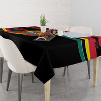 Mozambique Revolution Day tablecloth corner drape, black base with colorful emblem border.