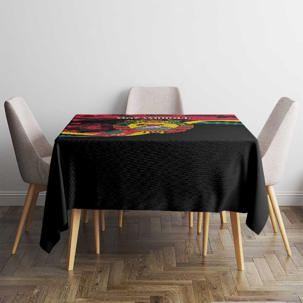 Mozambique Revolution Day tablecloth on square table, black with red green yellow top stripe.