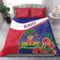 Haiti bedding set on bed with two red patterned pillowcases and red, white, blue tropical design