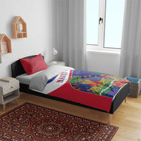 Haiti bedding set on dark bed frame with red patterned pillowcases and red, white, blue design