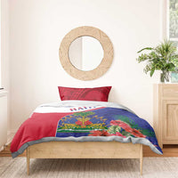 Haiti bedding set on wooden bed with red patterned pillowcases and red, white, blue tropical print
