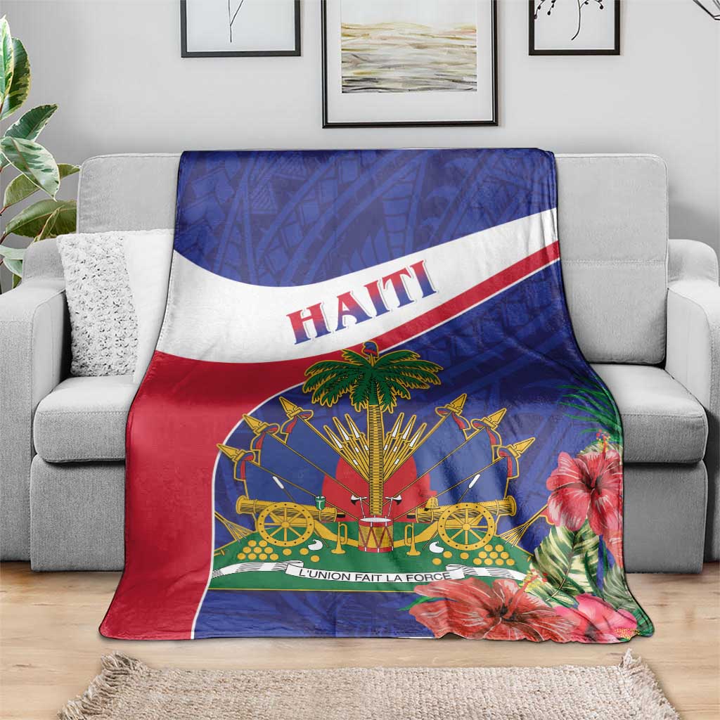 Haiti blanket on a sofa, blue and red design with Haiti text and tropical floral