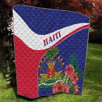 Haiti quilt blanket with blue, white, and red sections and hibiscus bouquet details