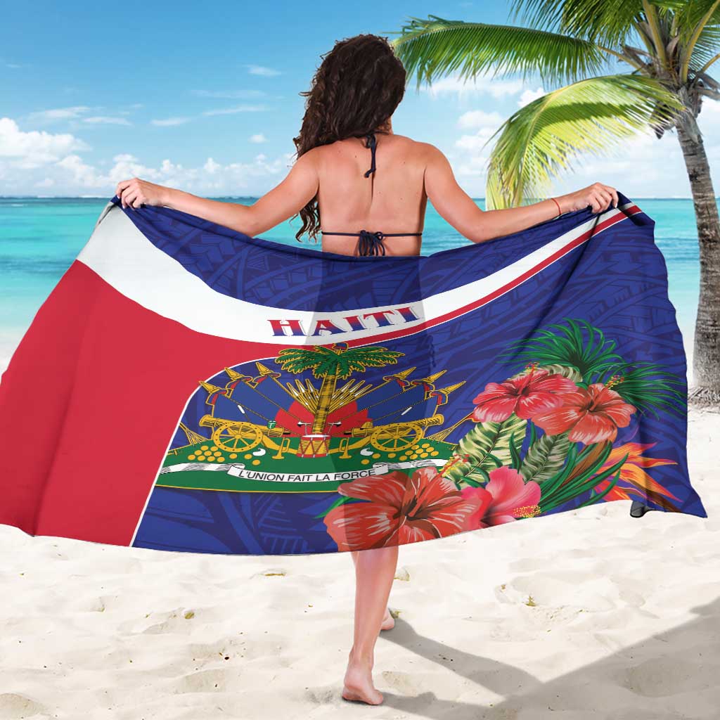 Blue sarong with red and white stripe, central Haiti text, hibiscus and palm print